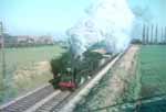 BR Standard class 9F 2-10-0 number 92139 approaches the main road bridge south of Laverton with the 4.15 Washwood Heath to Bristol freight  14/11/65 COPYRIGHT John Dagley-Morris